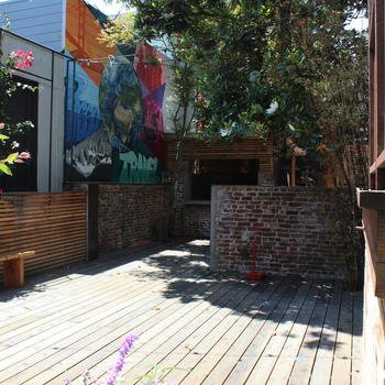 Loom - Our giant backyard patio comes with a gazebo, grill, garden and awesome graffiti art. An oasis in the middle of the city.