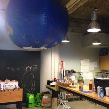 Kiva zip - We have fooseball, a chalkboard wall where people draw silly things, and a huge inflatable globe. We are fun, silly, and worldly.