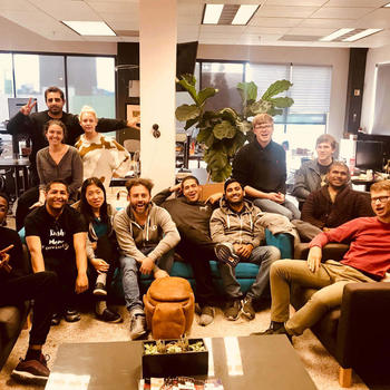 Yup Technologies Inc. - "Everyone say cheese" - team huddle right before a Friday happy hour