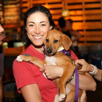 Ollie - Our Co-Founder Gabby Slome enjoying some puppy love at the annual fundraiser.