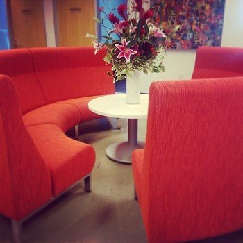Ask Media Group - No more offices! Common seating can be found all over.