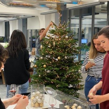 Popsa - Friendly and sociable team decorating the Christmas tree together