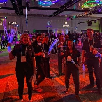 XUP Payments - A few folks from the XUP team at the HIMSS conference, with glow sticks to hand out to attendees