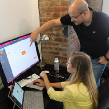 Tenna - Two of our team members collaborating on a project, collaboration is an important value at Tenna.