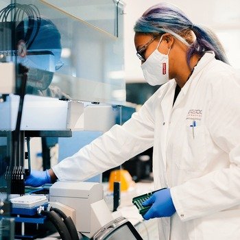 IDEXX Laboratories, Inc. - A female scientist working in a lab.