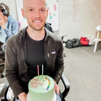 OneSchema - Photo of team member with birthday cake. 