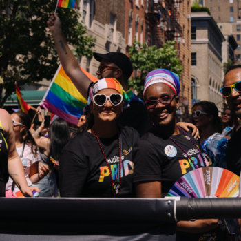 Audible - People posing for a photo at a Pride parade