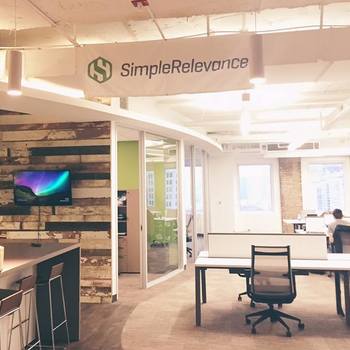 SimpleRelevance - Our office has an open layout, lots of natural light, and is decorated with modern furniture and reclaimed wood.